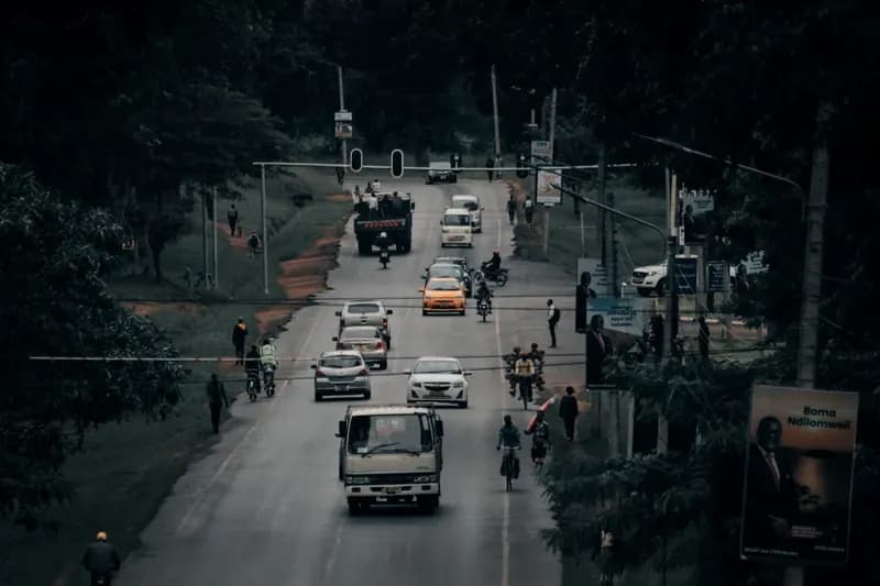 Tree-lined road with traffic in Lilongwe, Malawi