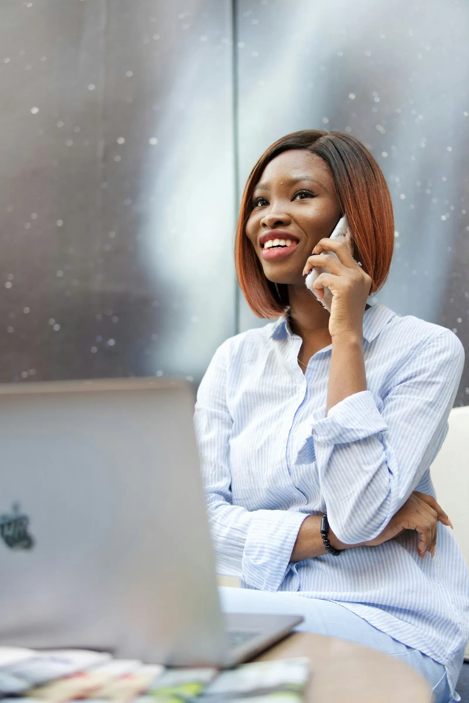 Woman on a phone call at her laptop